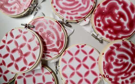 Red recycled cellulose used as a pattern on fabric