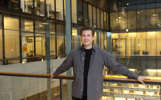 Jari Saramäki standing inside the Department of Computer Science.