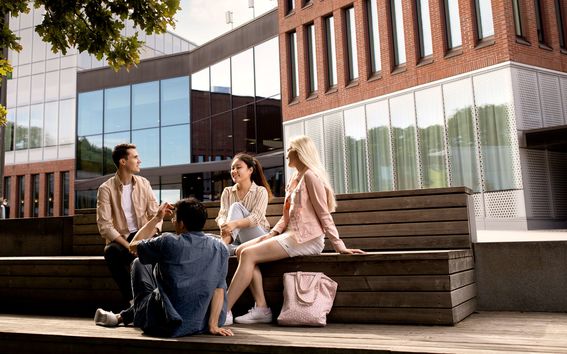 students sitting outside