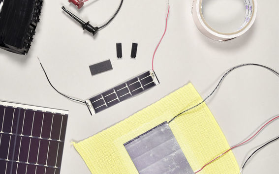 Solar cells laminated on the back side of textiles in the Sun-Powered Textiles project