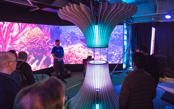 Audience looking at an art piece.