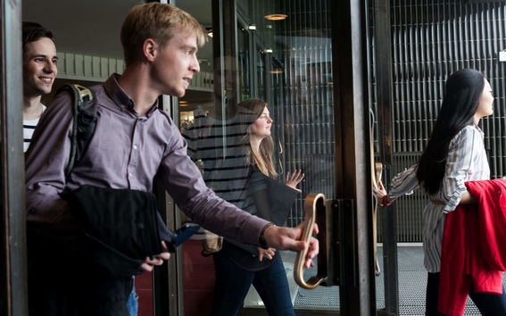 Students are walking out from the Undergraduate Center