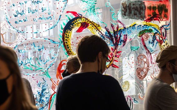 People in front of the painted window.