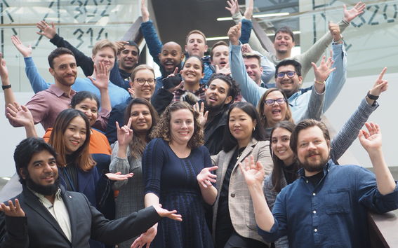 Group photo captured in Väre of happy Digital Business students waving to the camera.