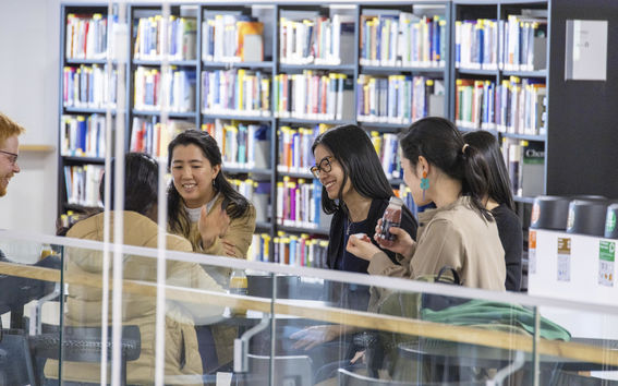 students and a book shelf