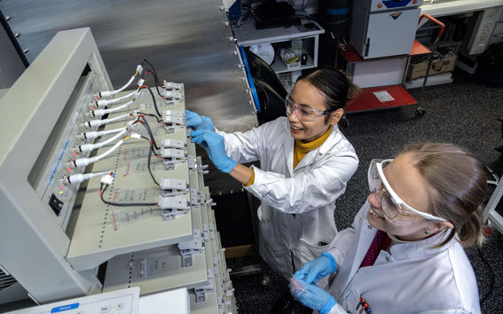Two students in the battery lab