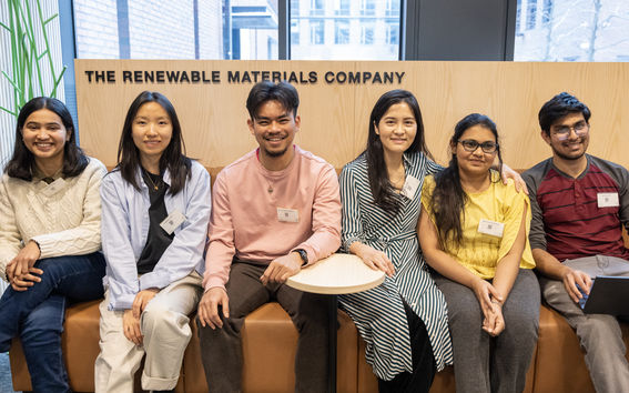A group of students sitting on a sofa