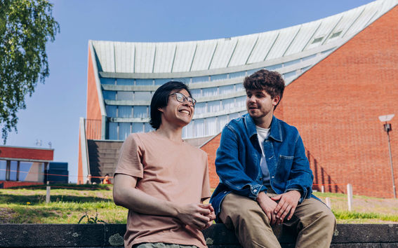 Two students on Aalto University campus.