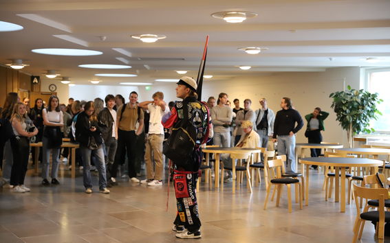 Fuksi captain and new students at Otakaari 1 hallway