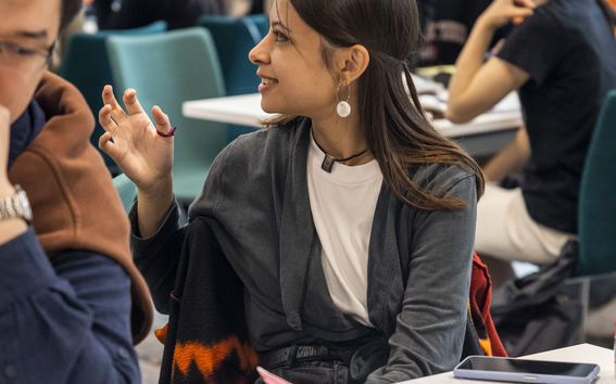 Christina raising her hand during one of the Self Leadership sessions.