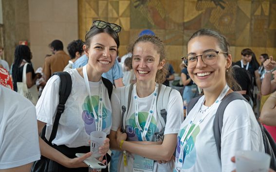 Photo of three participants at the Unite! Student Fair wearing Unite! t-shirts. 