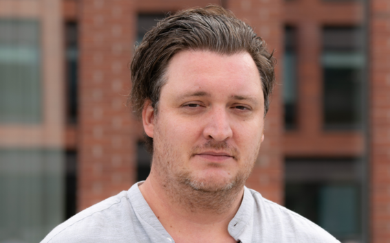 Game Design summer school course teacher Edwatd Morell looking straight into the camera. He has light brown hair and brown eyes.