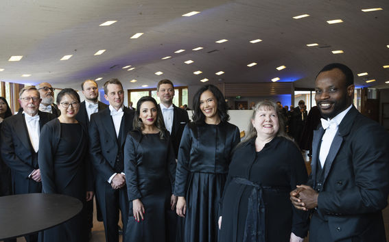 Doctors dressed in black celebrating their promotion as doctors