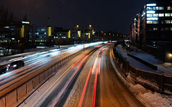 Cars driving on the highway at night
