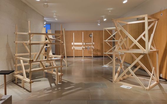 View of exhibition space showing wooden frames
