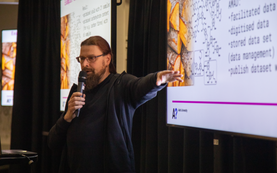 Professor Patrick Rinke giving a presentation about AMAD.