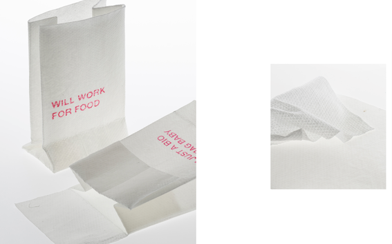 A white paper bag like packaging with a pink phrase saying ”will work for food”