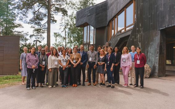 Staff Training Week participants in front of the Dipoli building at Aalto University. 