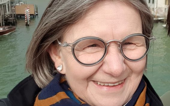 Woman with eyeglasses in selfie photo taken in Venice, Italy