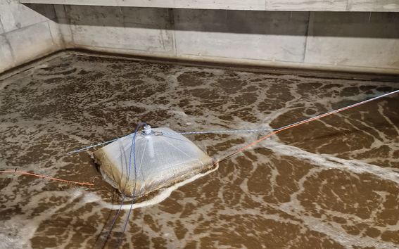 Greenhouse gas emissions monitored from a wastewater treatment process with an off-gas hood.