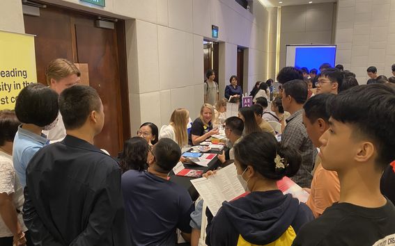 Queue at Aalto's stand at the student recruitment fair in Hanoi on 9.11.2024, with Topi Hukkanen, Hang Le, Eeva Liinamo-Liukku, and Annika Paananen representing Aalto. 