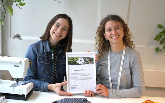 Aalto Repair and Rewear co-founders posing for a photo in their workspace.