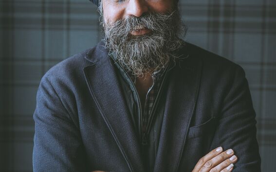 A headshot of Indy Johar