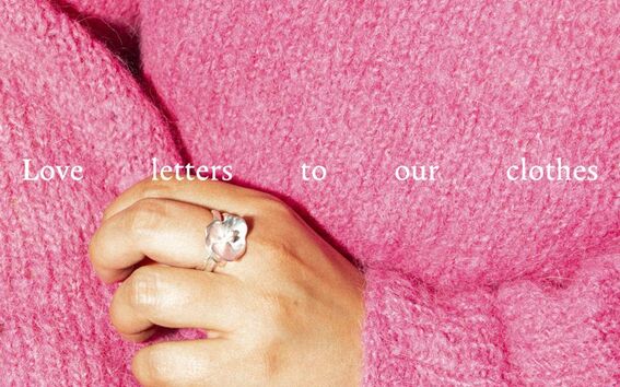 A hand wearing a flower ring rests on a pink, knitted fabric with exhibition details text overlaid.