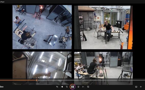 A video of a workshop with four split-screen frames showing people working with tools and machinery in an industrial setting.