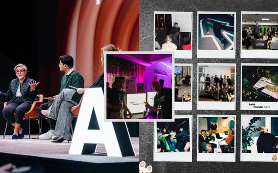 Panel on stage with large white letter A, beside collage of colourful event Polaroids on dark wall