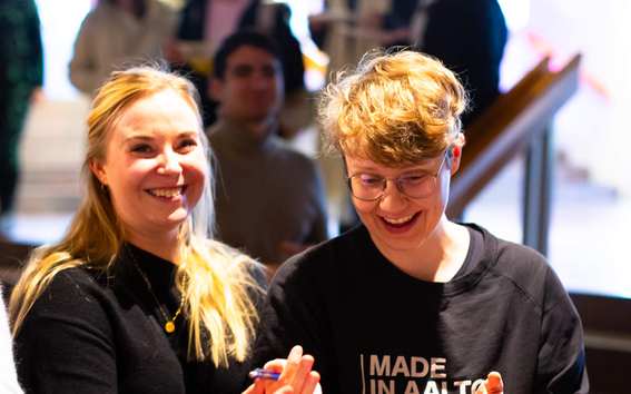 Two women laughing.