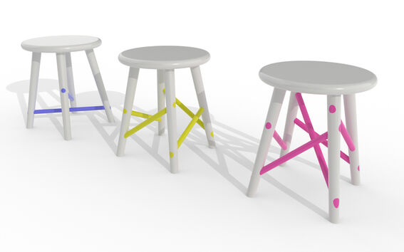 Three white round stools in a row, each with different coloured cross-braces: blue, yellow and pink.