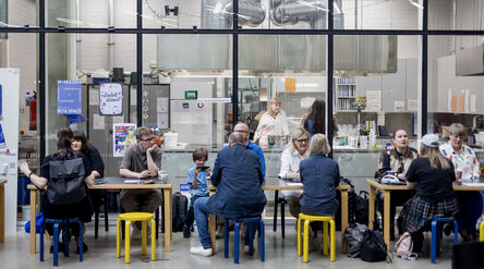 Alumni discussing across multiple tables