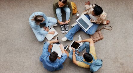 Adobe stock picture
Study, laptop and group of students on floor in project, research or planning, brainstorming and teamwork. Notebook, education and top of university student, friends or people collaboration in school