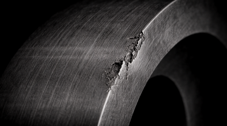 Mechanical defect in the ring of the ball bearing.