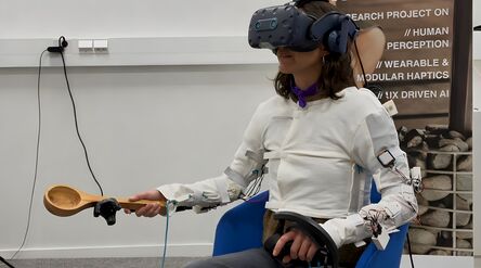 Image shows a person wearing a thermal interface that produces dynamic heat in a VR experience