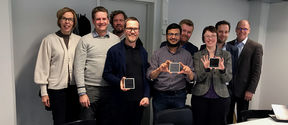 The perotech team members, holding printed solar devices