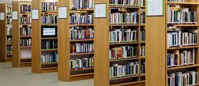 Bookshelves full of books at Aalto University Learning Centre