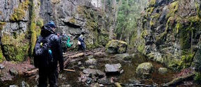 Students in Mustavuori (black mountain) caves area