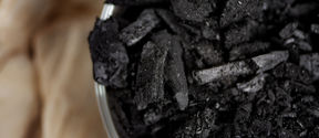 black biochar in a bowl