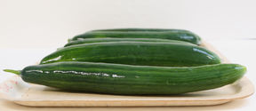 cucumbers on a plate covered with biobased liquid