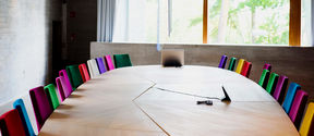 View of a meeting room with multicolored chairs in Dipoli / Photo: Aalto University, Markus Sommers