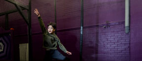 A boy jumping on a mixed reality trampoline in Superpark