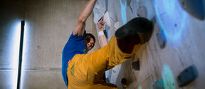 Person climbing on an augmented climbing wall