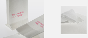 A white paper bag like packaging with a pink phrase saying ”will work for food”