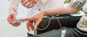 In Aalto ELEC Health Technology labratory researcher tested persons blood pressure.