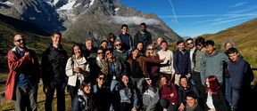 Group of students with the Alps in the background.