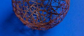 willow fibre ball on a blue surface