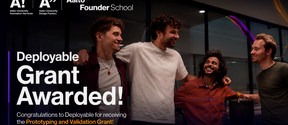 Four people celebrating a Deployable grant award, with large white text and Aalto Founder School logos.