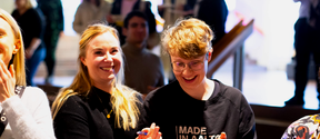 Two women laughing.